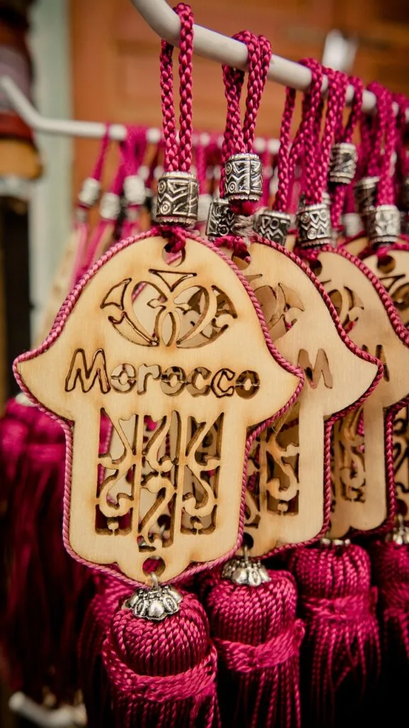 fatma's hand, morocco, keychain, souvenirs, hand, character, ornament, follower, souvenier, symbol, wood, wooden flakes, lasered, laser cut, laser engraving, engraved, cut, section, engraving, linked, yarn, cord, yarn cord, hang, purple, wood cutting, writing, arabic, moroccan, oriental, morocco, morocco, morocco, morocco, morocco, laser cut, laser engraving, laser engraving, laser engraving, laser engraving